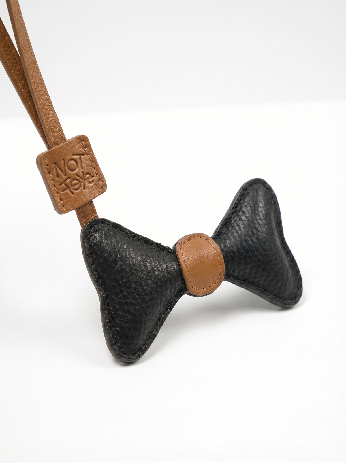Bowtie Charm - CamelXBlack - detail view